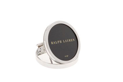 Ralph Lauren silver circular picture frame with black center, shown open with clasp.