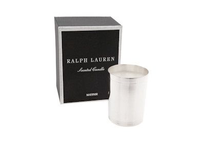 Ralph Lauren silver scented candle vessel displayed next to its black luxury gift box.