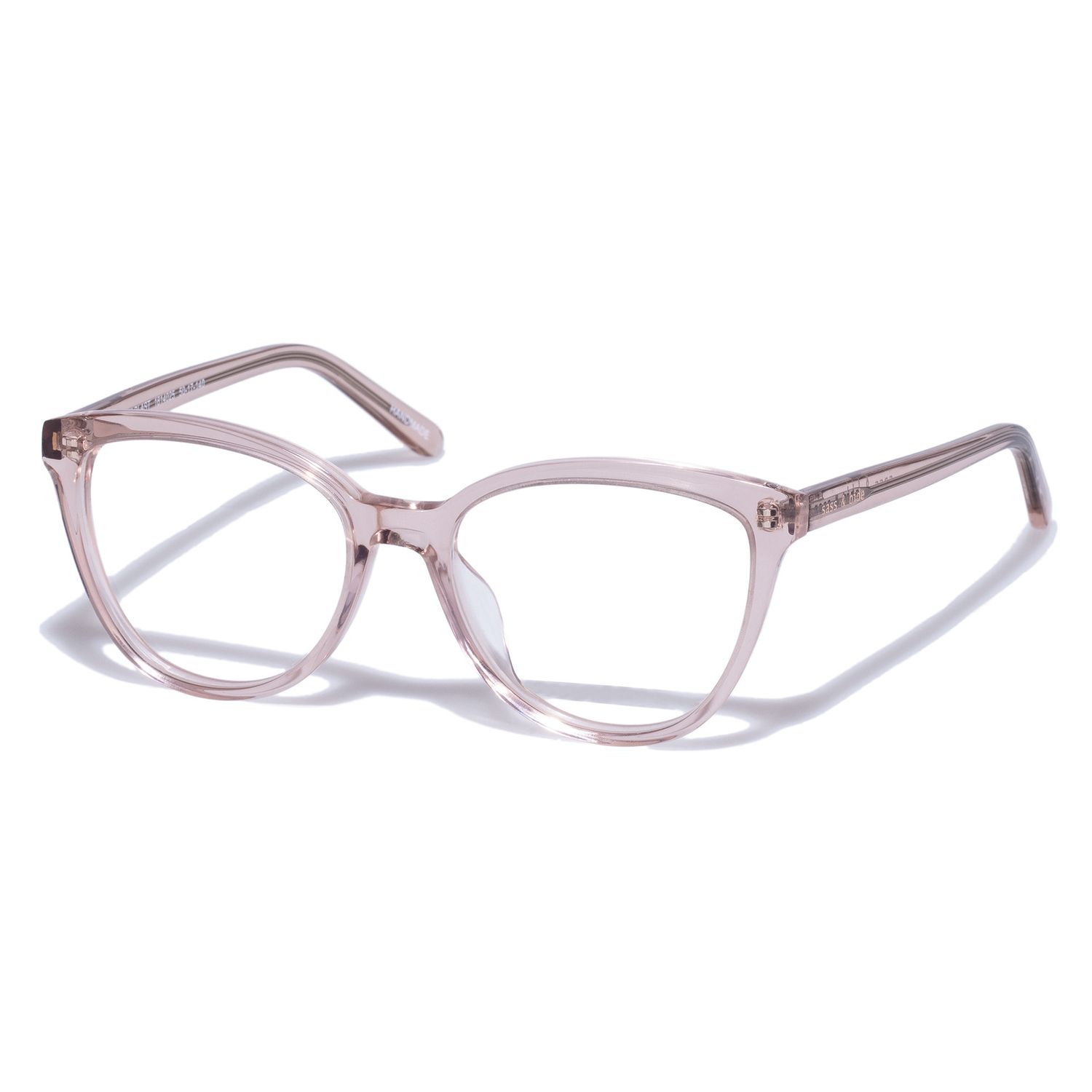 Transparent blush pink cat-eye eyeglasses frames on white background.
