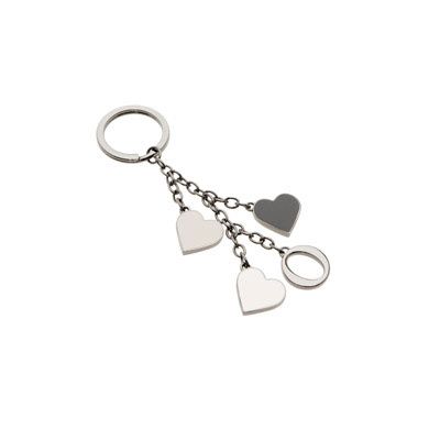 Silver keychain featuring three heart-shaped charms on delicate chain links.