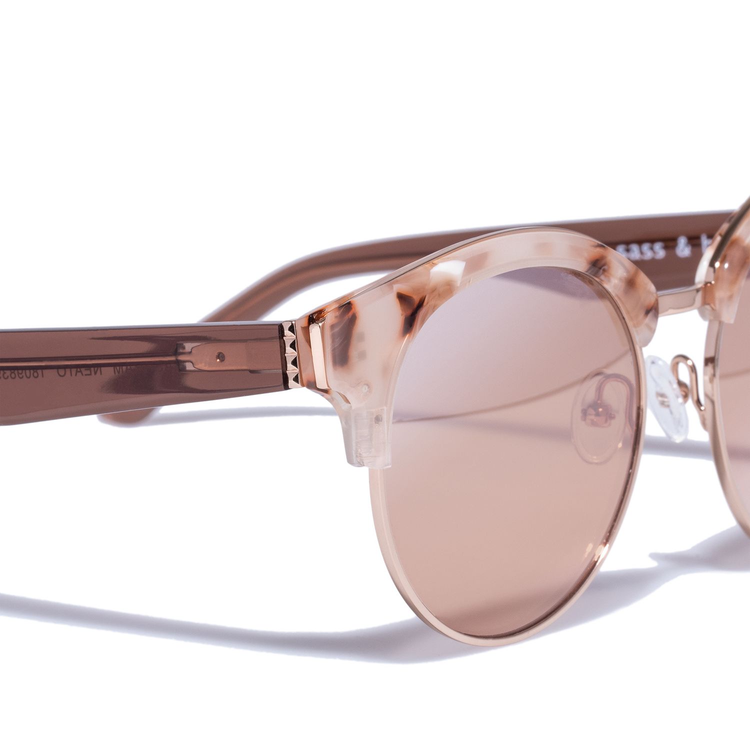 Rose gold mirrored clubmaster sunglasses with transparent pink frames on white background.