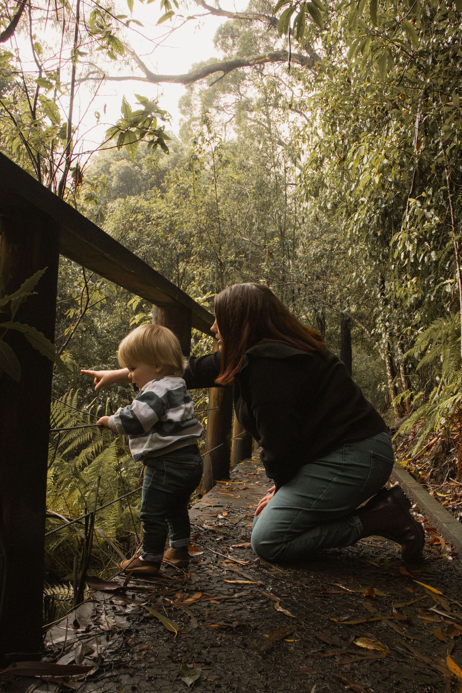 A child and mum exploring at Uralla reserve in the outdoors in central Gippsland. Taken for a motherhood session.