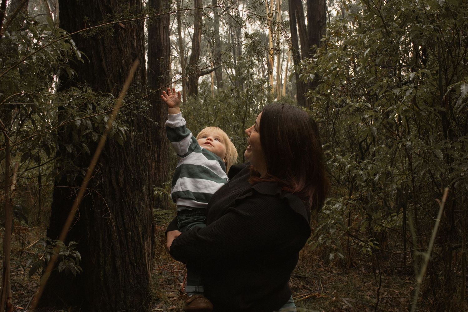A child and mum candid portrait at Uralla reserve in the outdoors in central Gippsland. Taken for a motherhood session.