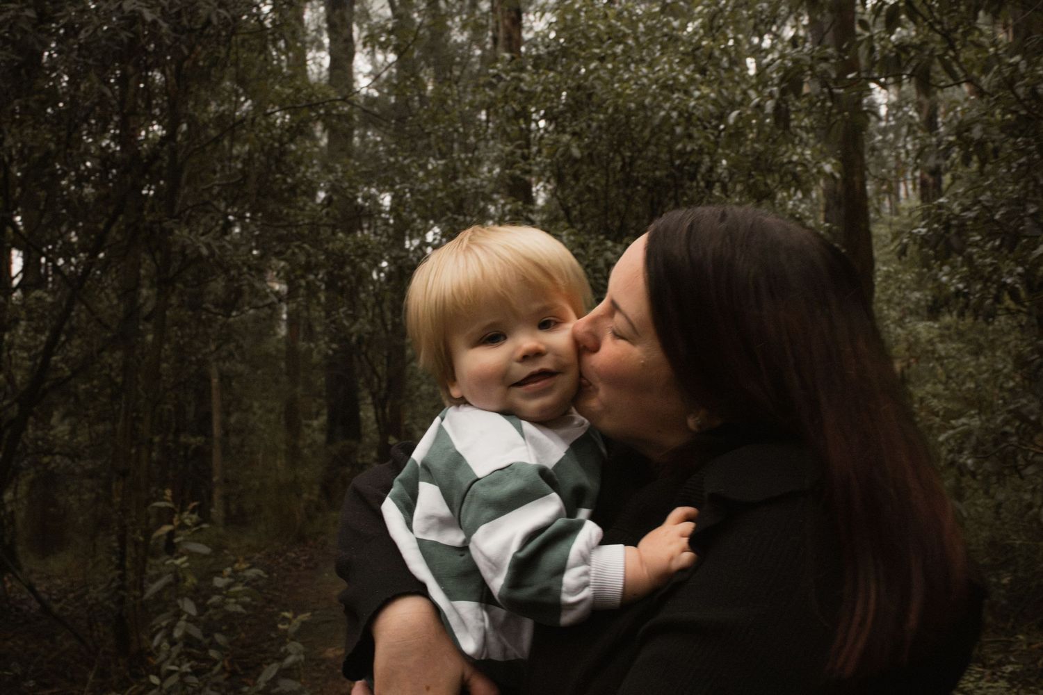 A child and mum candid portrait at Uralla reserve in the outdoors in central Gippsland. Taken for a motherhood session.