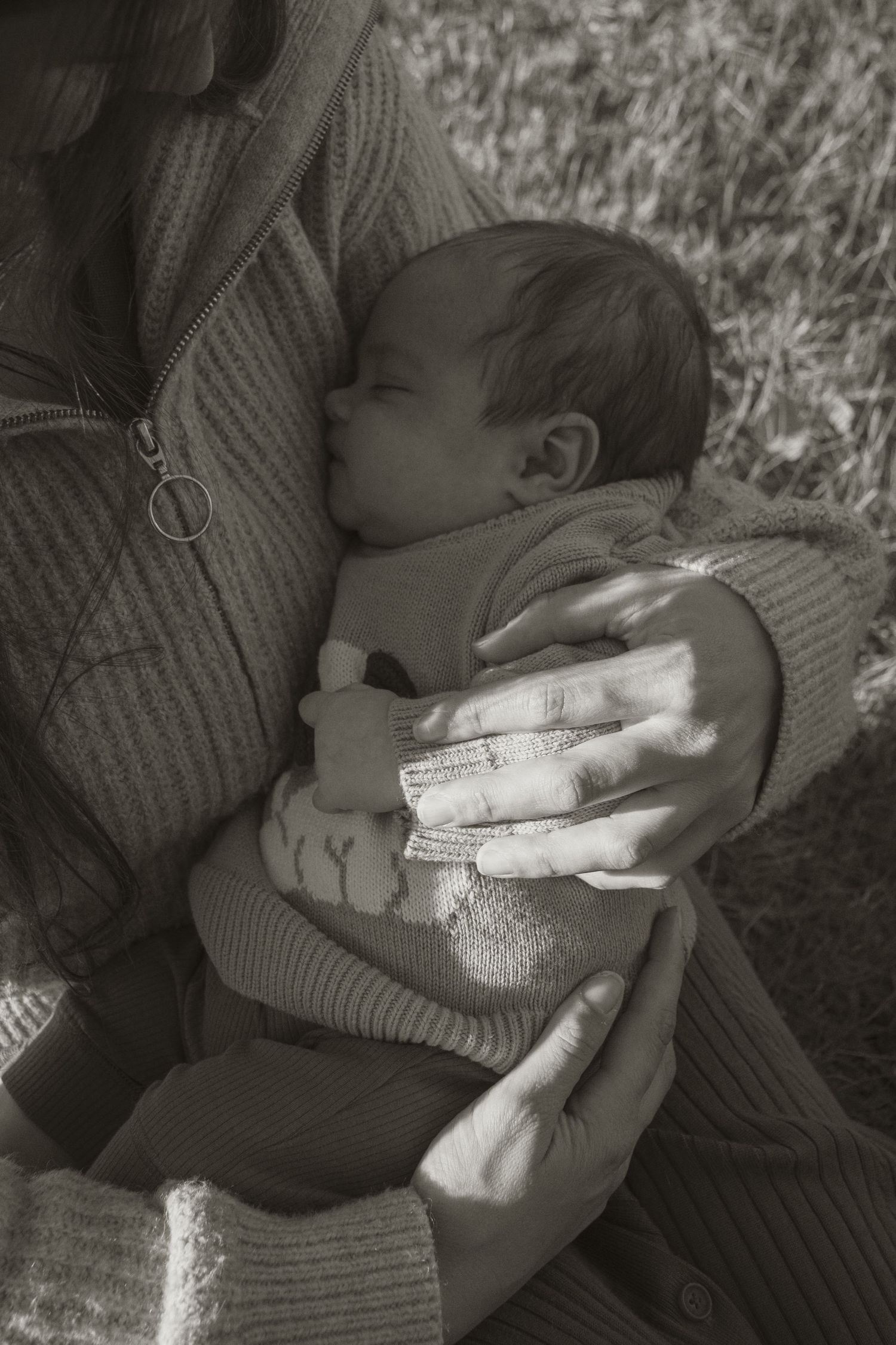 A baby at blue rock lake with family in the outdoors in central Gippsland. Taken for a motherhood/pet session.