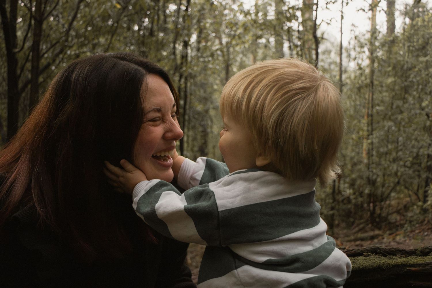 A child and mum laughing at Uralla reserve in the outdoors in central Gippsland. Taken for a motherhood session.