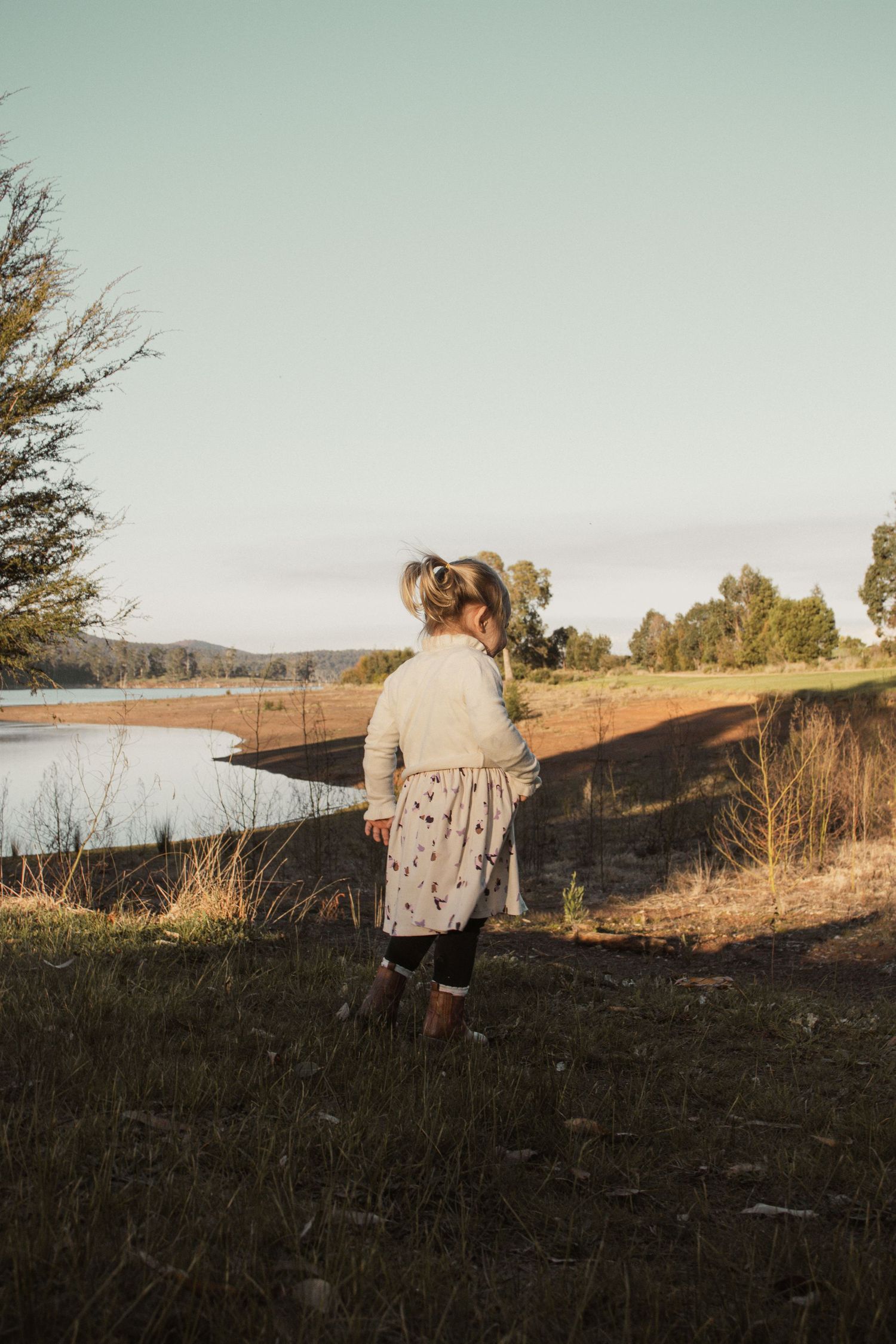 A child at blue rock lake in the outdoors in central Gippsland. Taken for a motherhood/pet session.