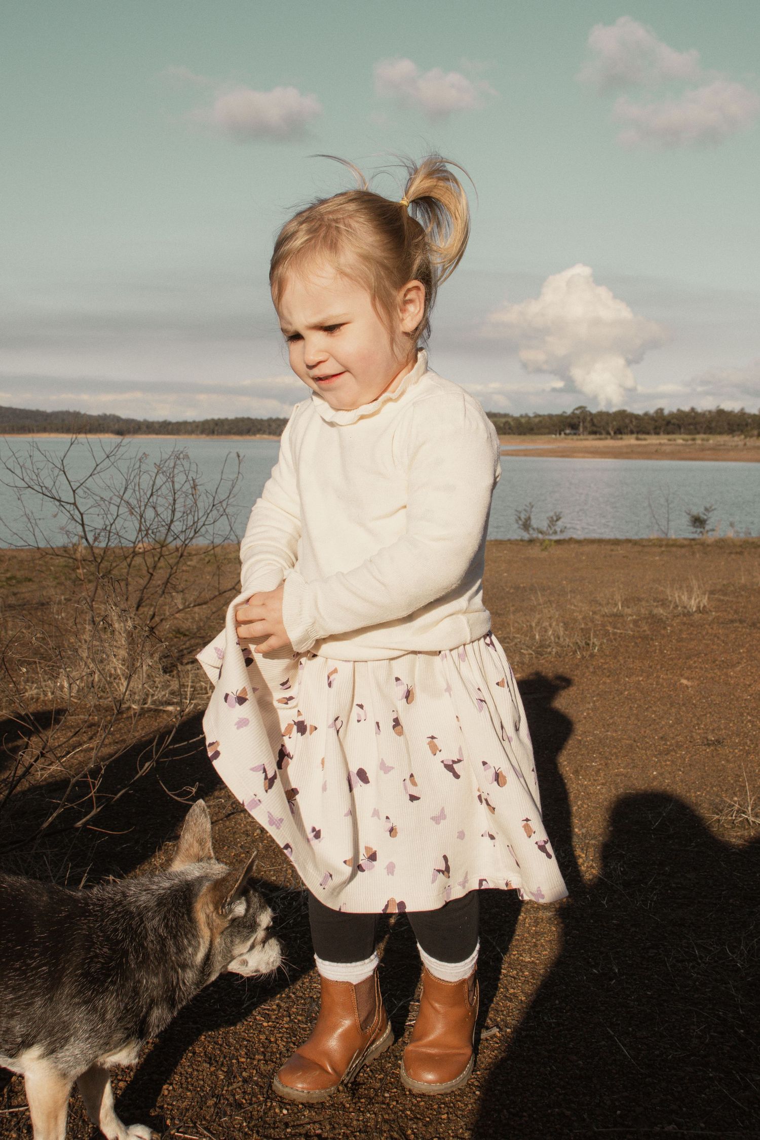 A child at blue rock lake with family in the outdoors in central Gippsland. Taken for a motherhood/pet session.