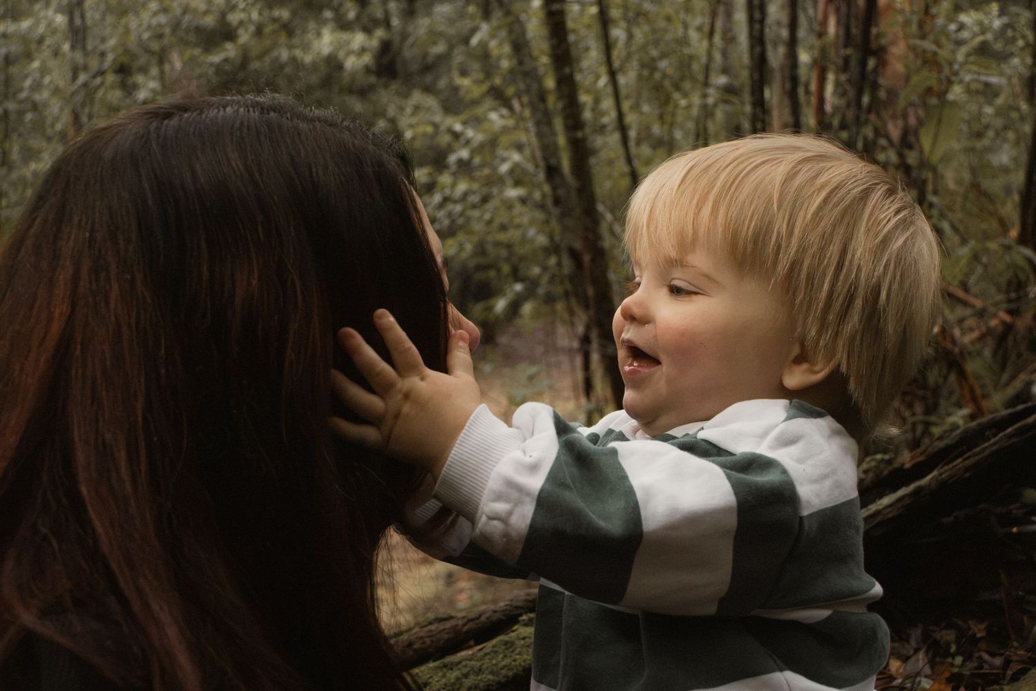 A child and mum playing together at Uralla reserve in the outdoors in central Gippsland. Taken for a motherhood session.