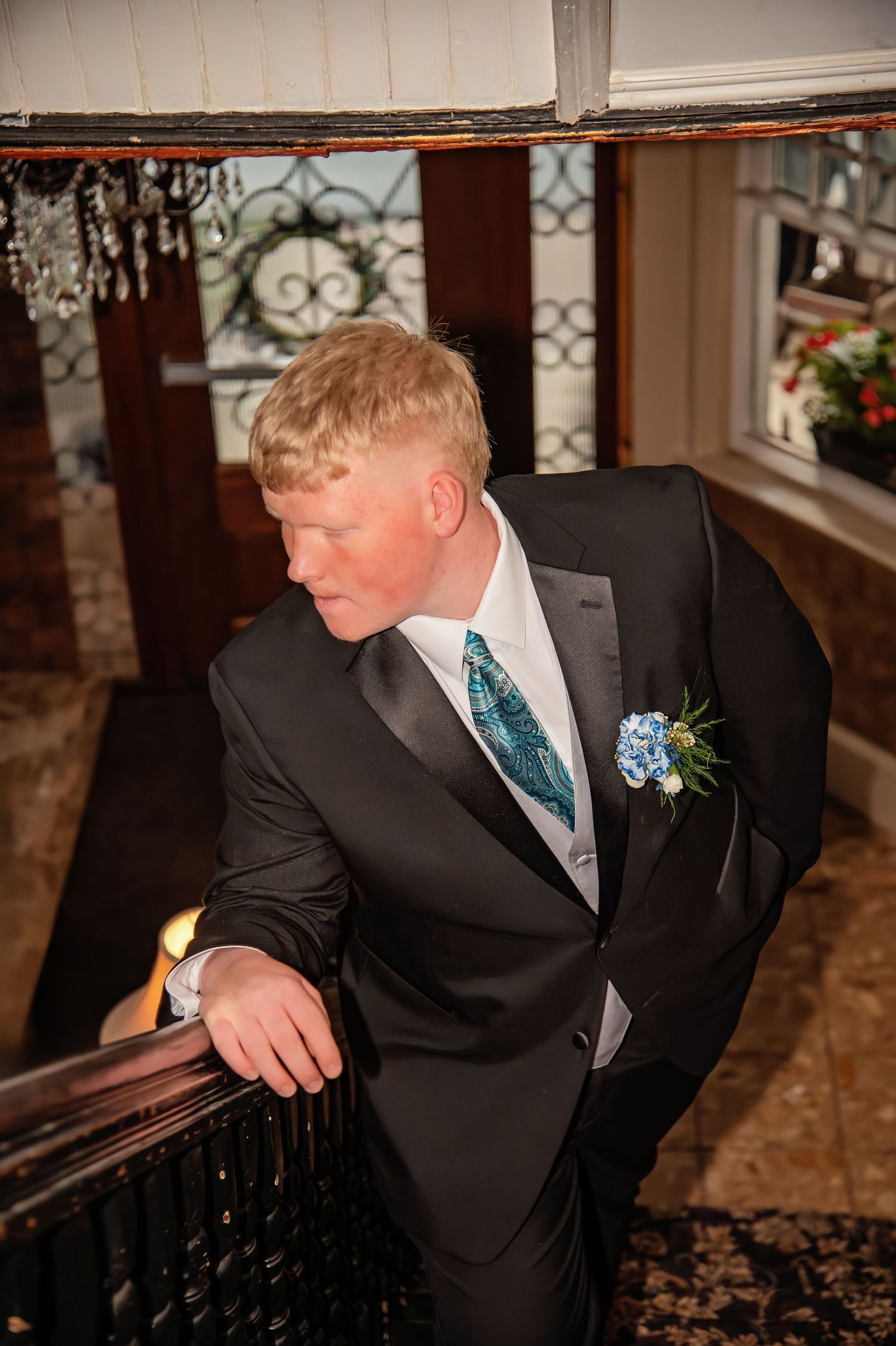 Formal event photography in an ornate indoor setting with decorative details.