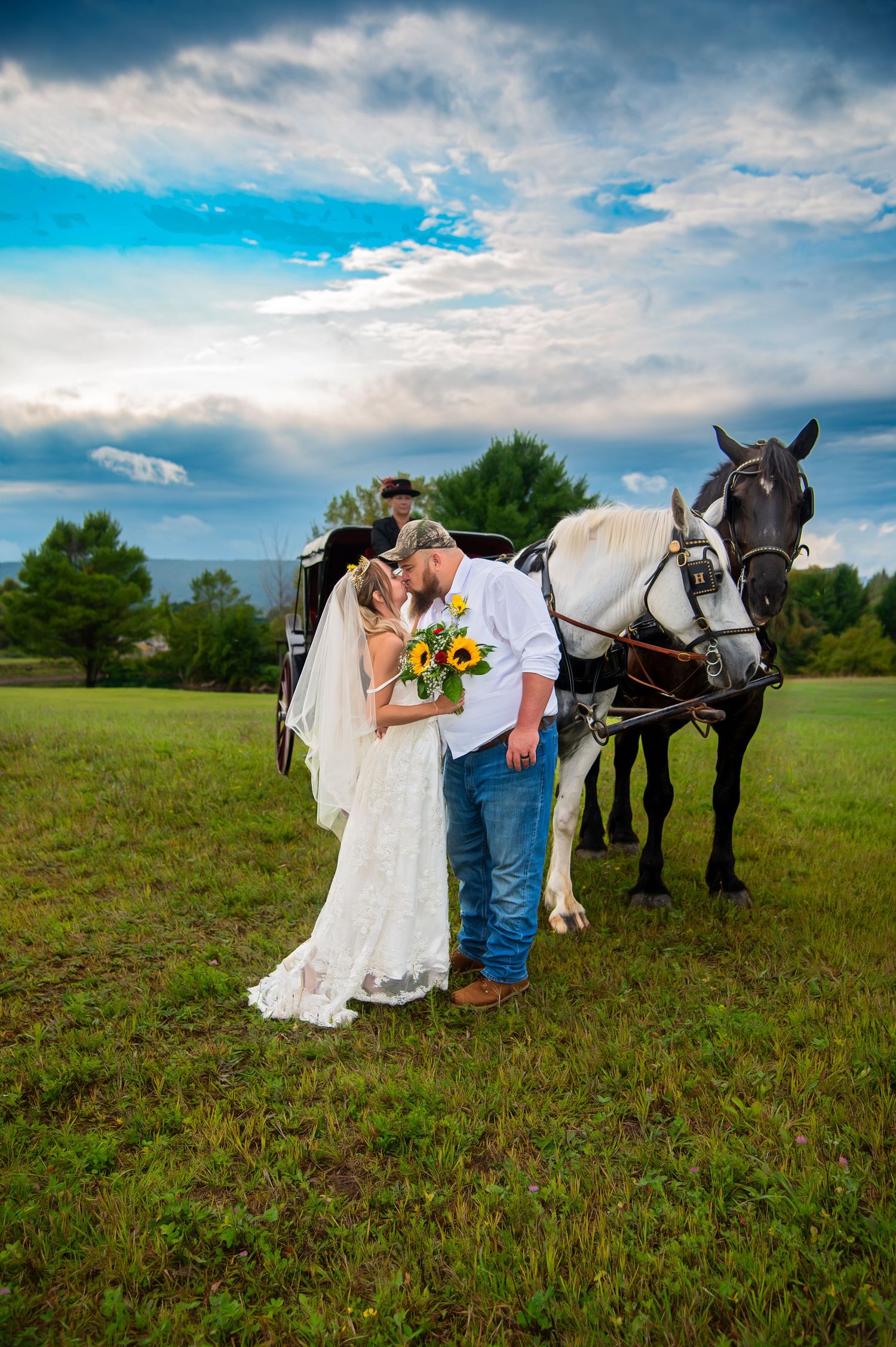 Romantic country wedding photos with horses in a rustic field setting.