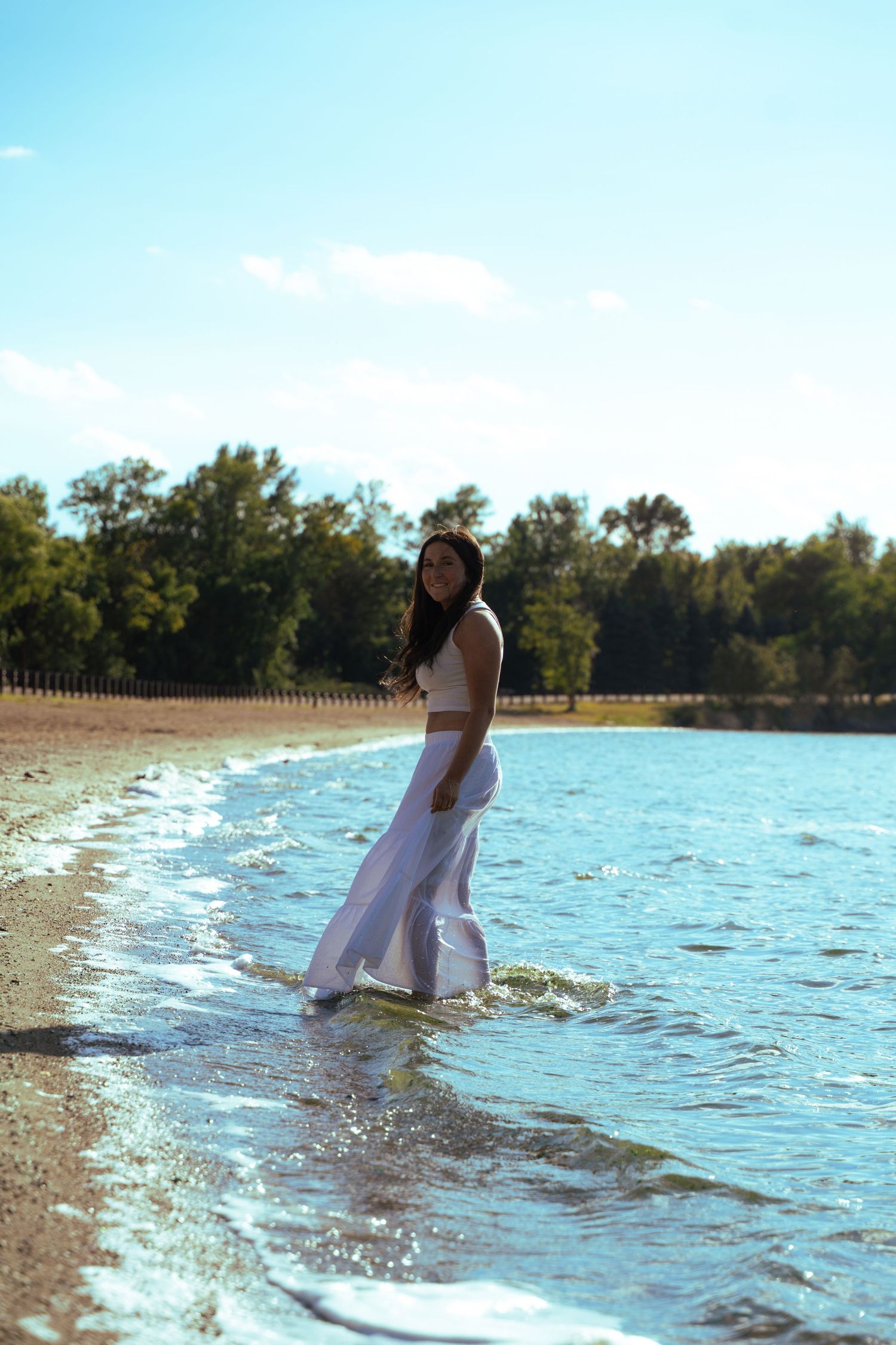 A portrait of a girl posing near a lake by Evan Patzwald Media.
