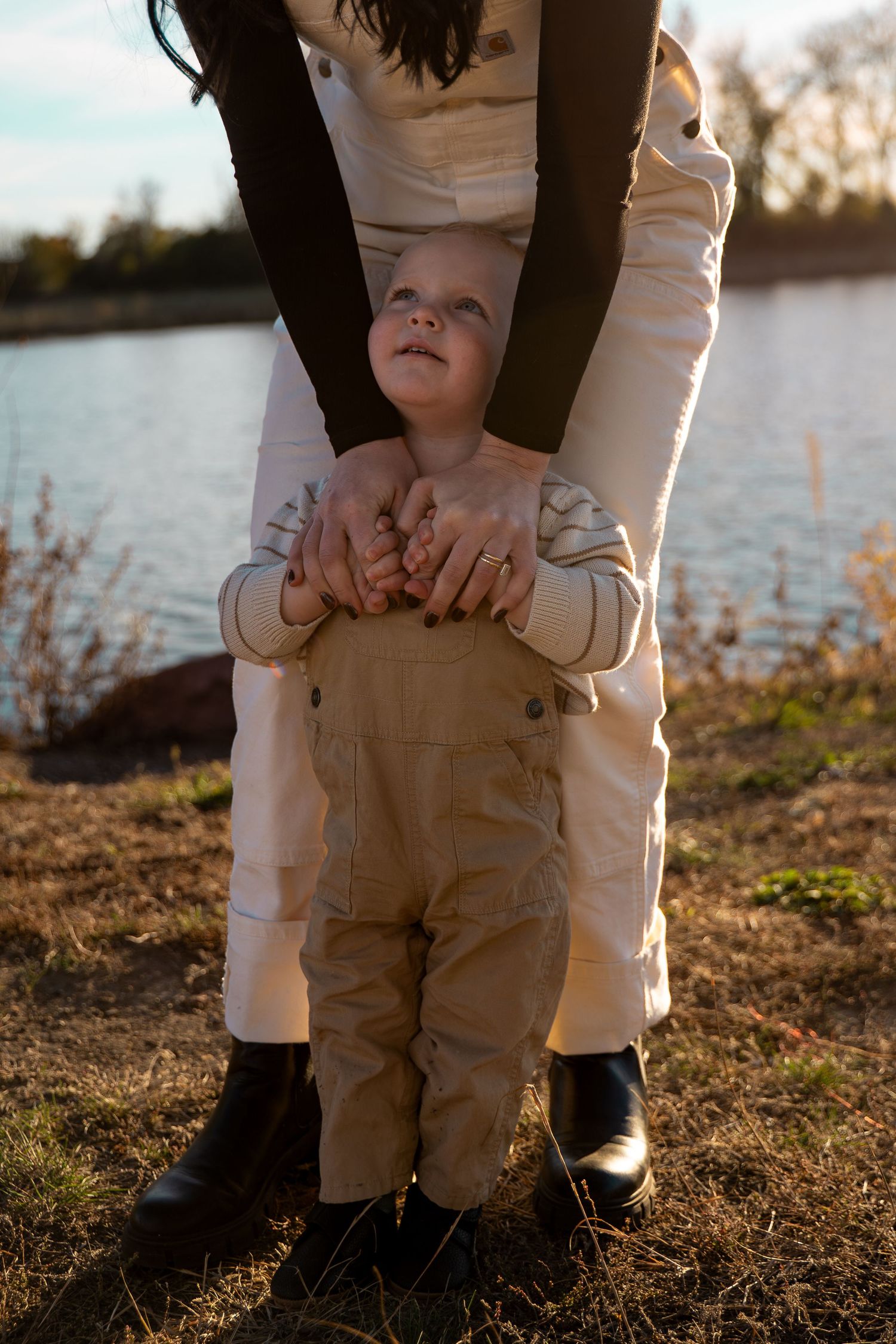 A portrait of a mom holding her child by Evan Patzwald Media.
