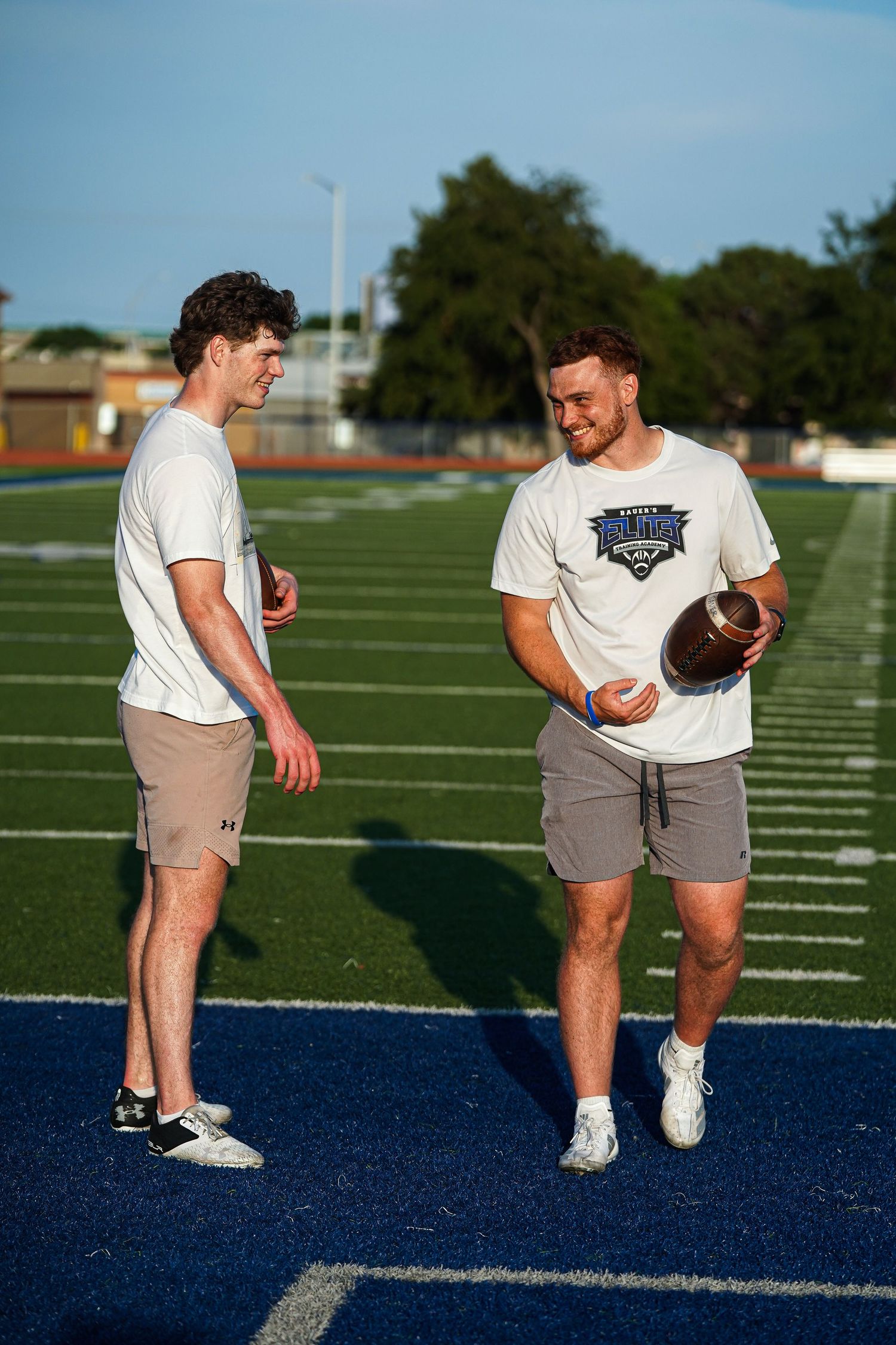 A photo of two men on a football field by Evan Patzwald Media.