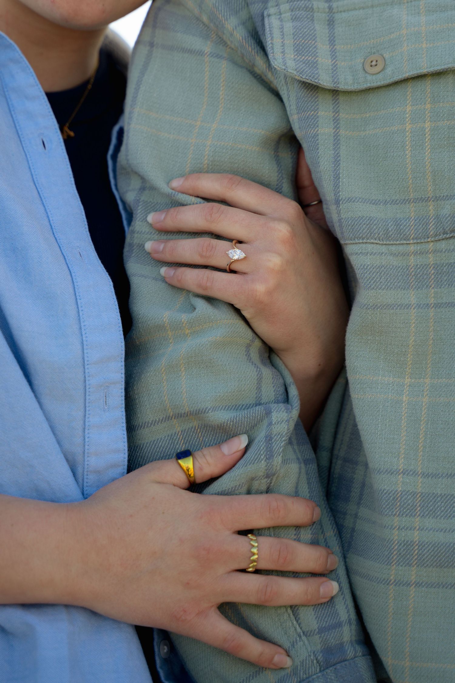 A closeup portrait of a couple's engagement ring for an engagement session by Evan Patzwald Media.