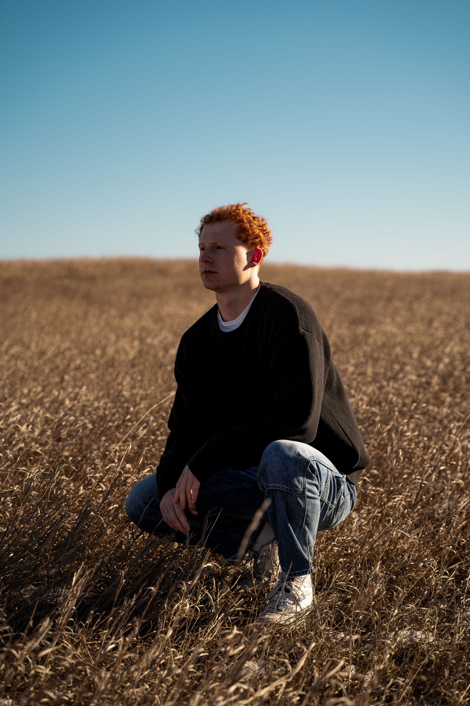 A portrait of a man in a field by Evan Patzwald Media.