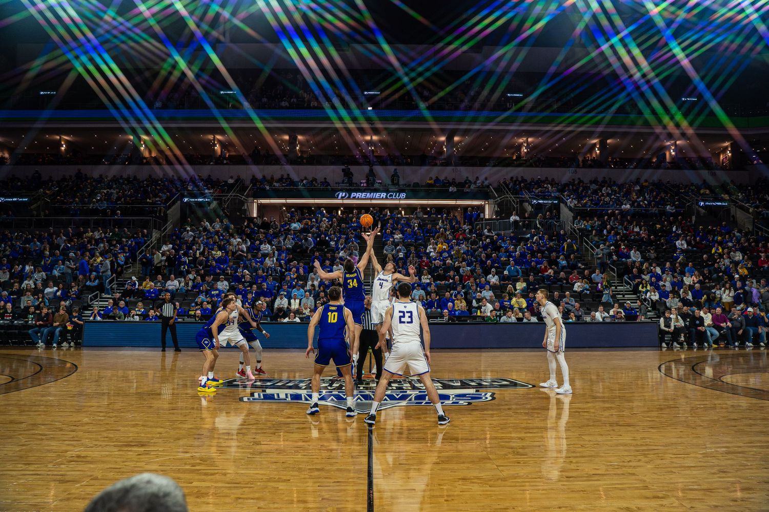 A photo of a jump ball at the Summit League Tournament in Sioux Falls by Evan Patzwald Media