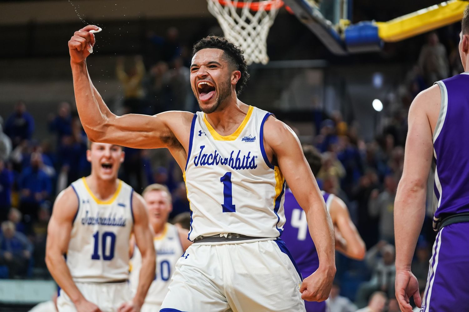 A photo of a South Dakota State University men's basketball player celebrating by Evan Patzwald Media.