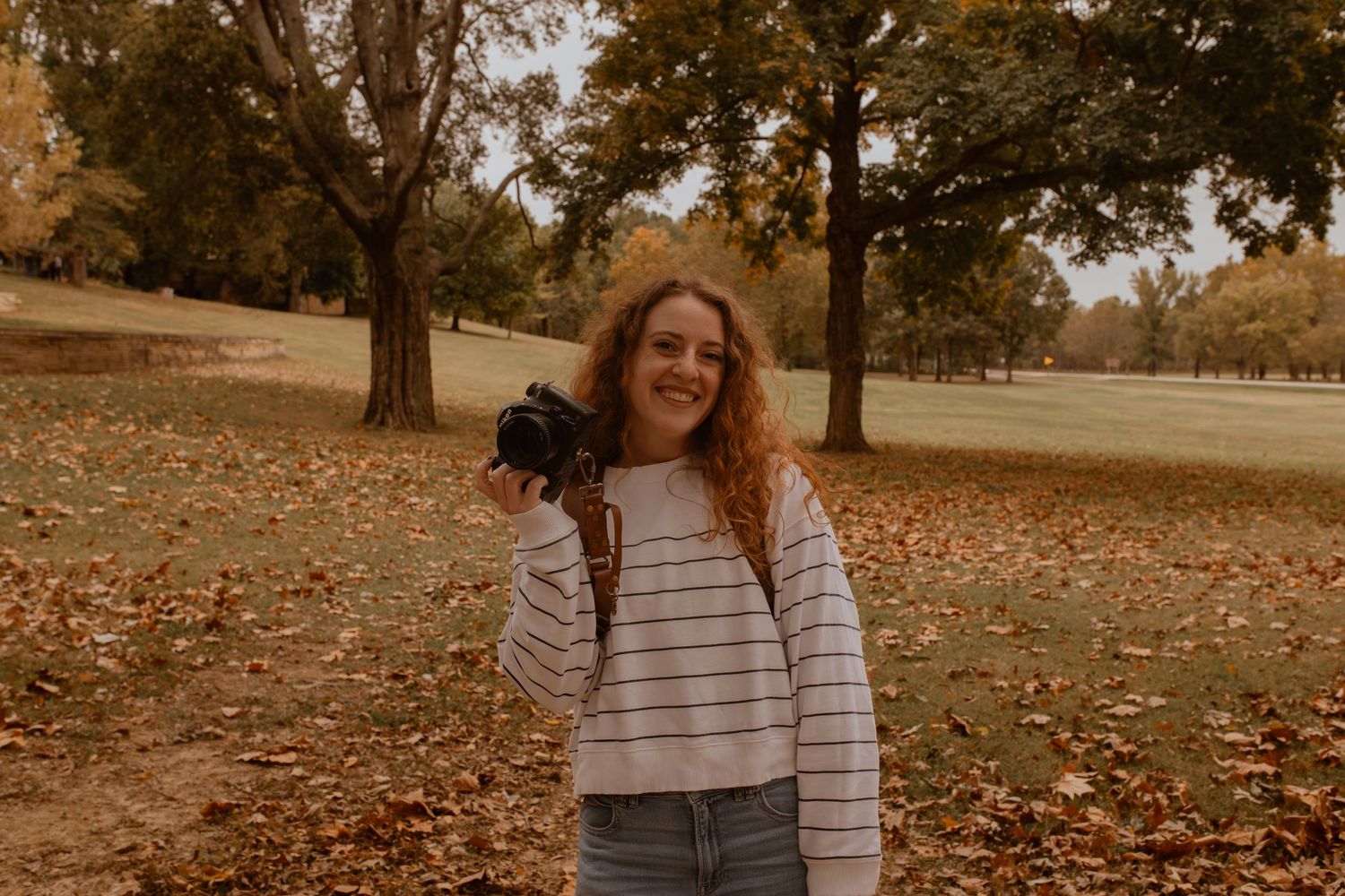 A woman holding a camera