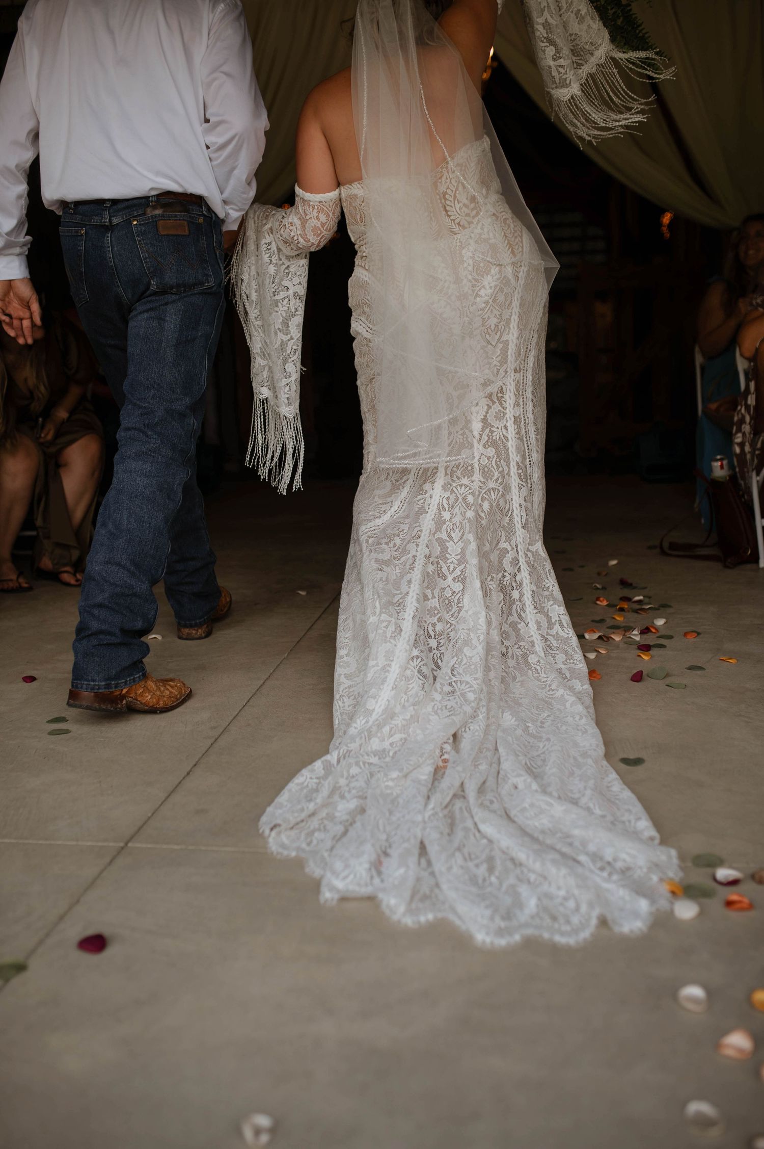A bride and groom leaving their ceremony