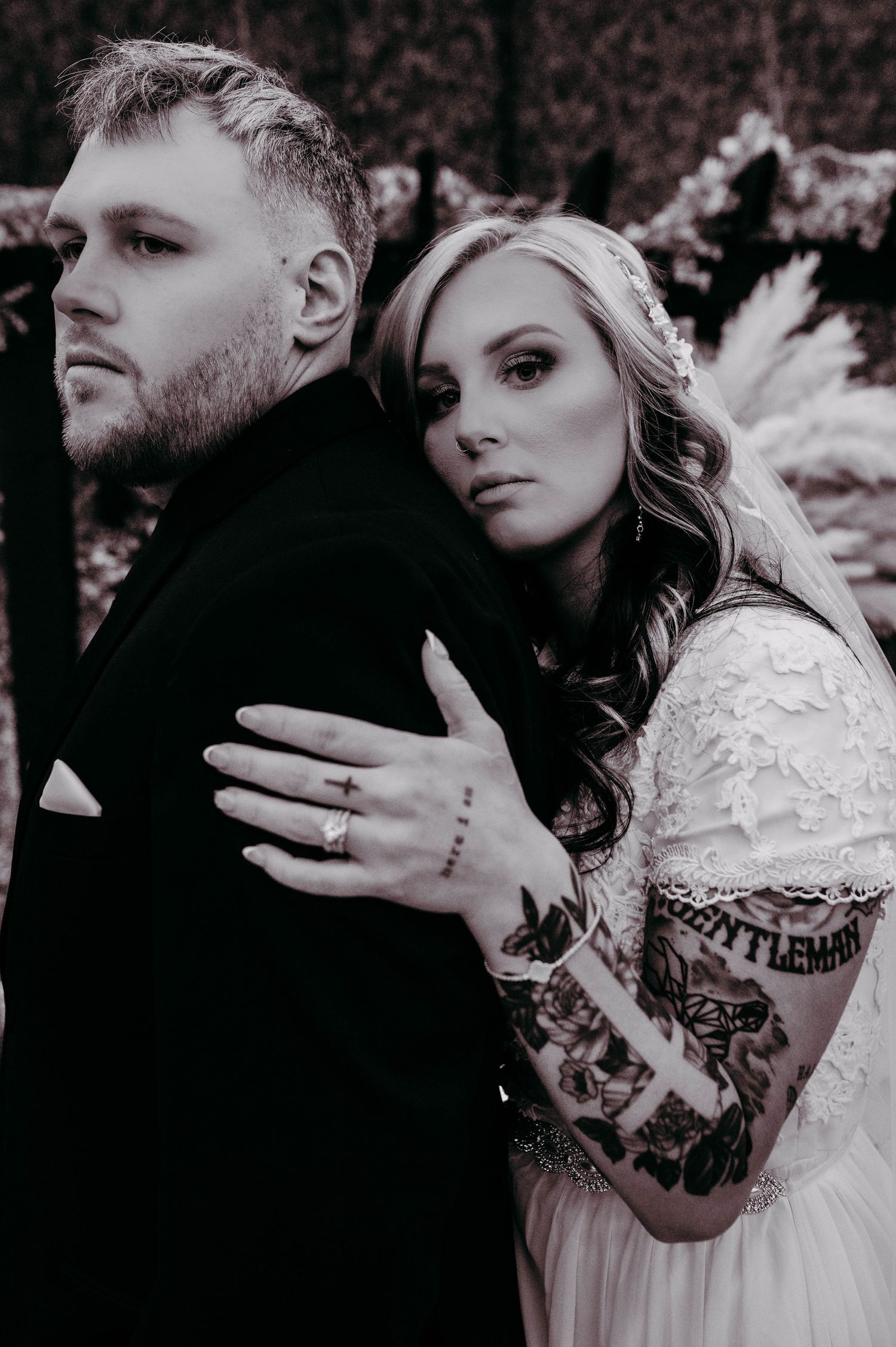 A bride and groom embracing.
