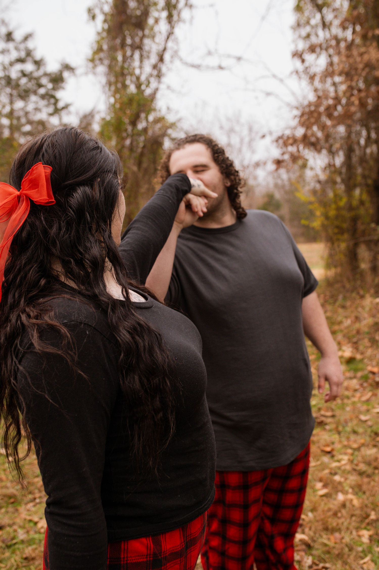 A man kissing a woman's hand.