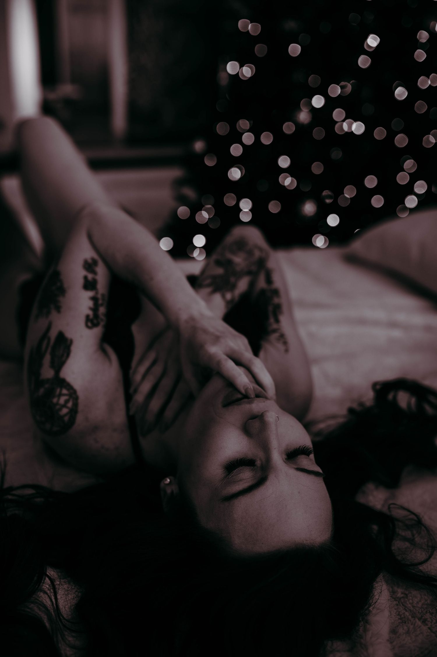 A woman in lingerie on a bed.