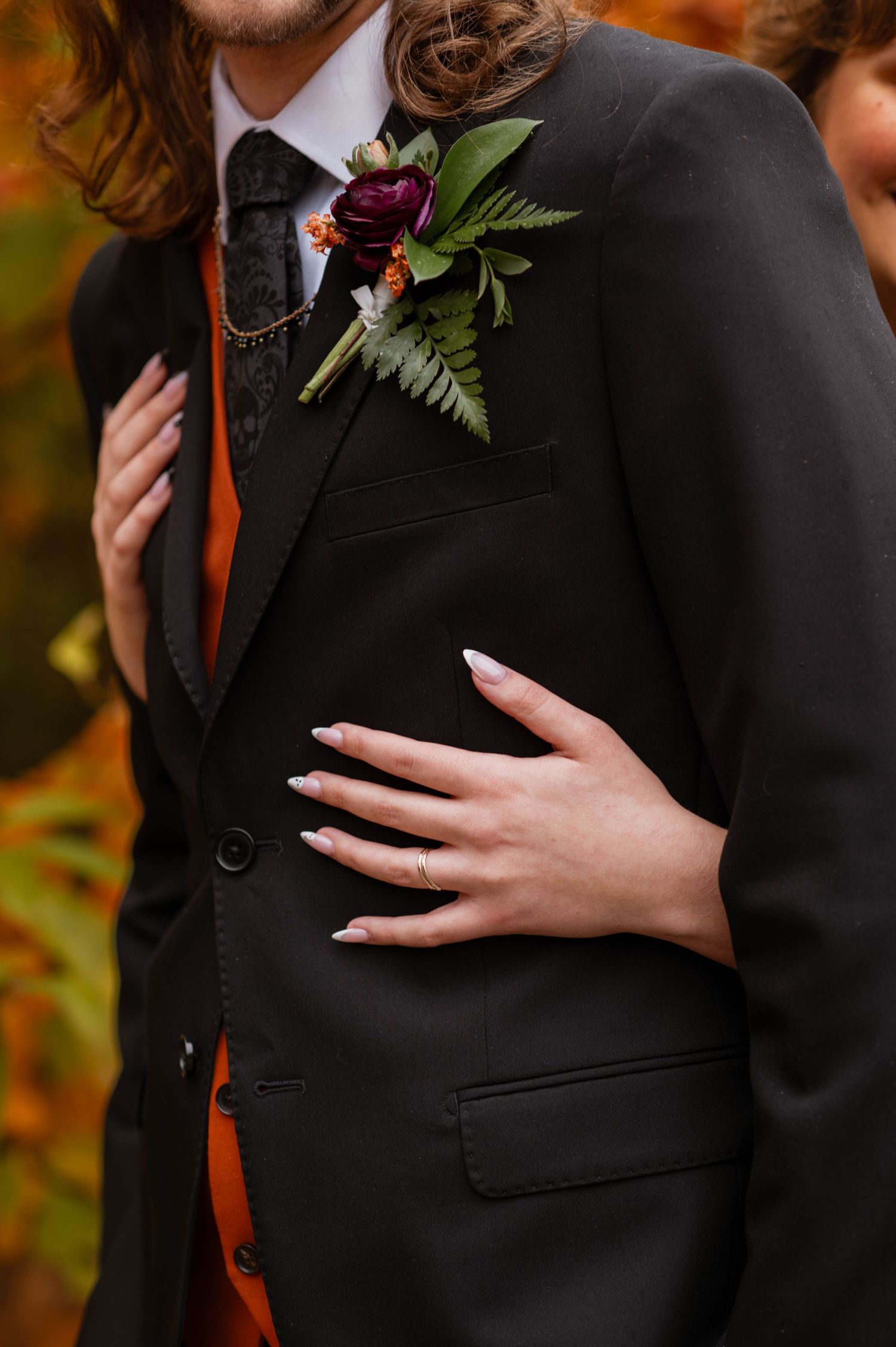hands on front of tuxedo