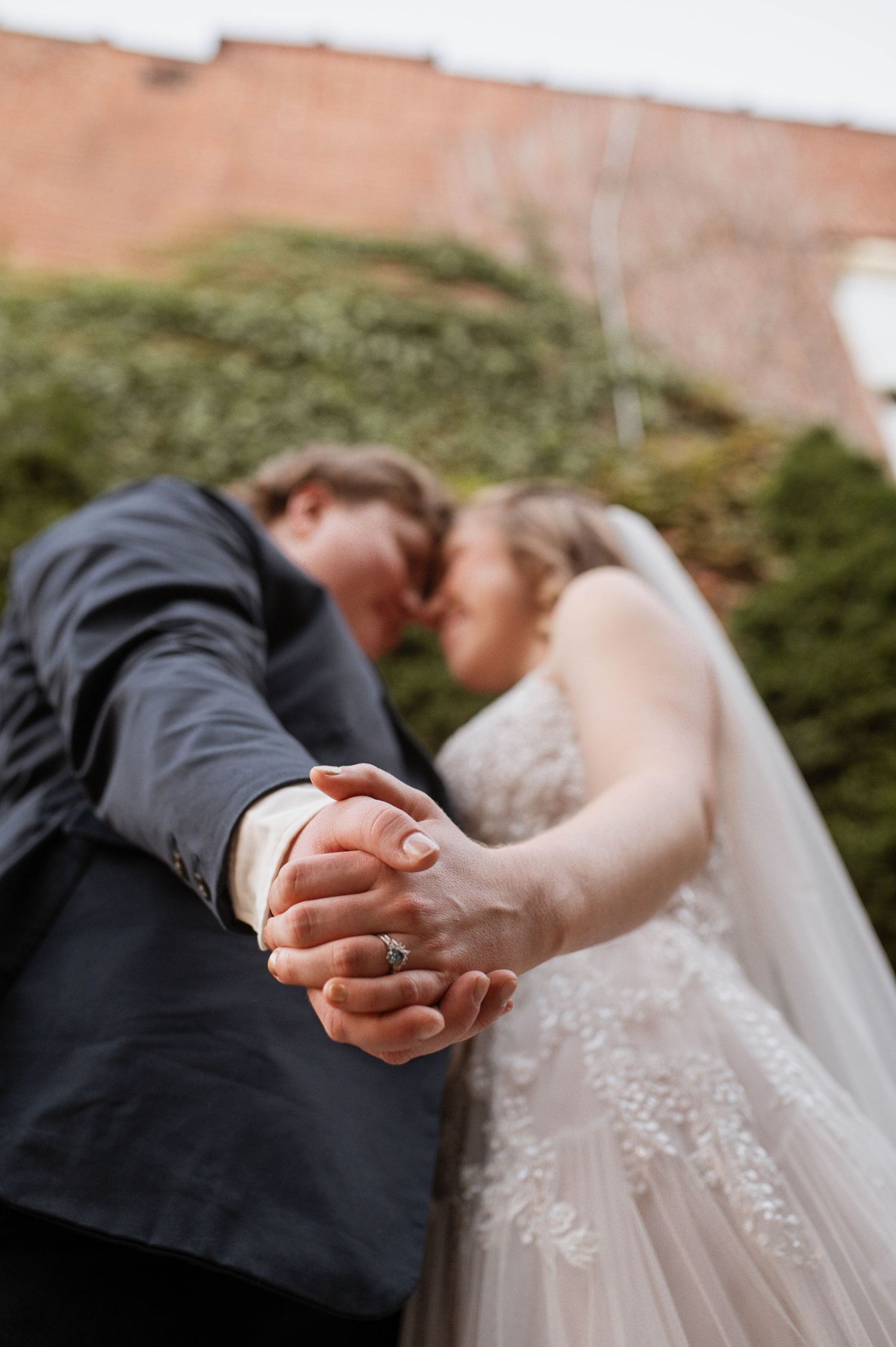 Two married people holding hands
