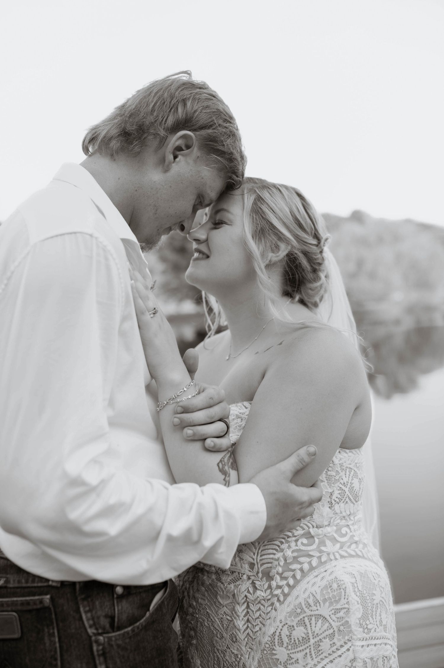 A bride and groom embracing.