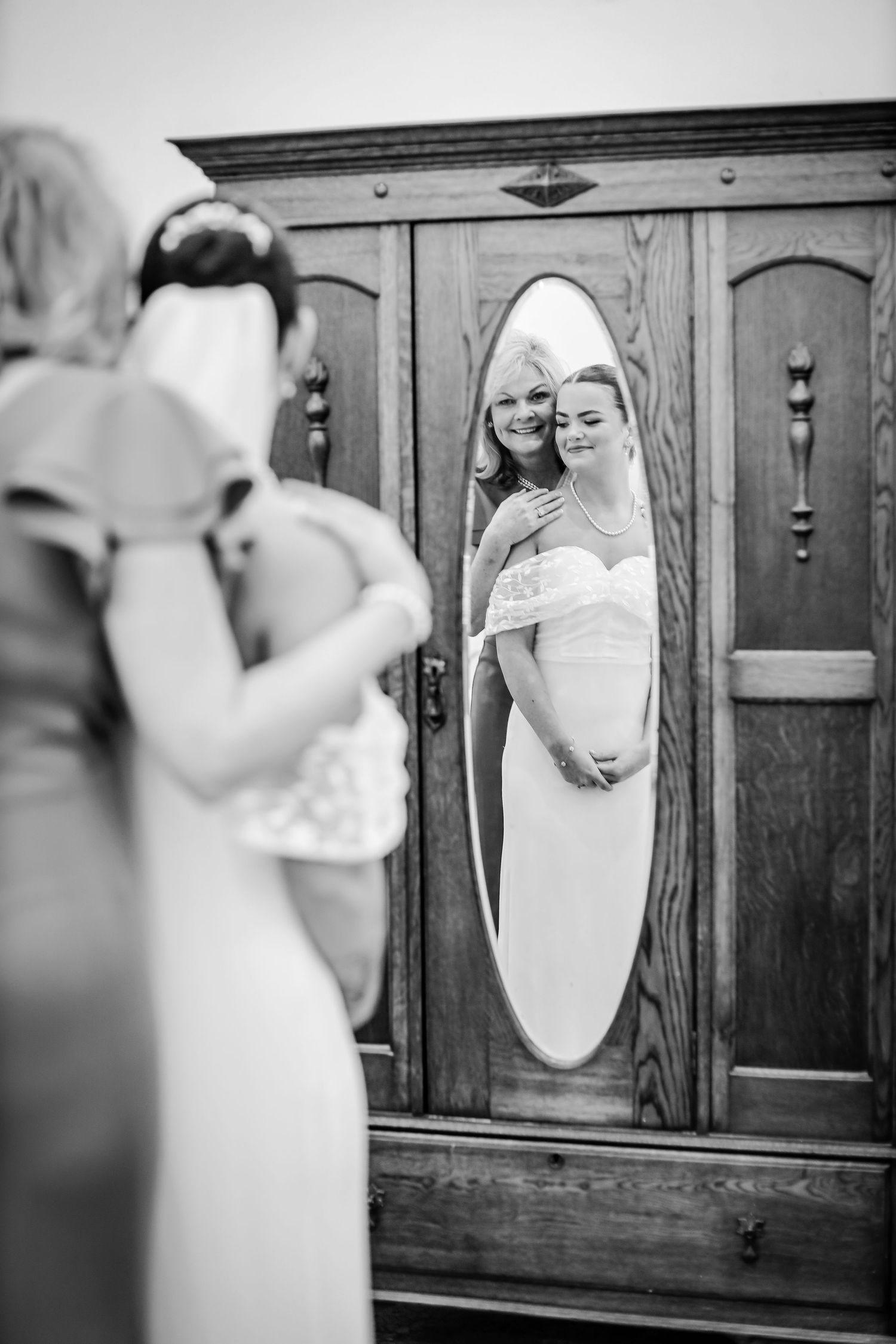 Black and white wedding photography series showing reflections in vintage wooden mirrors.