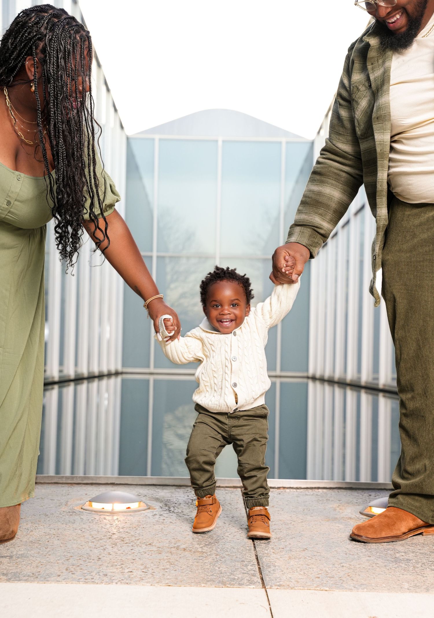 A sequence of playful moments captured on an outdoor rooftop in olive green outfits.
