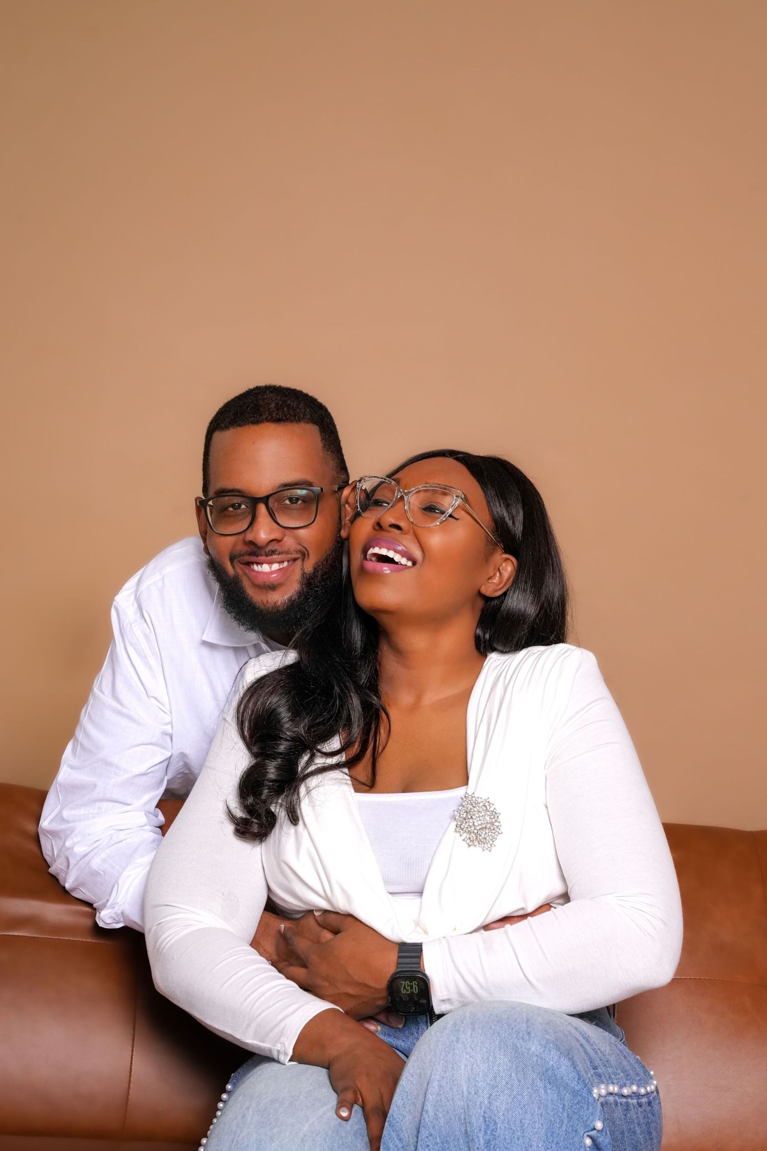 Candid couple photography session showing joyful laughter and natural interactions.