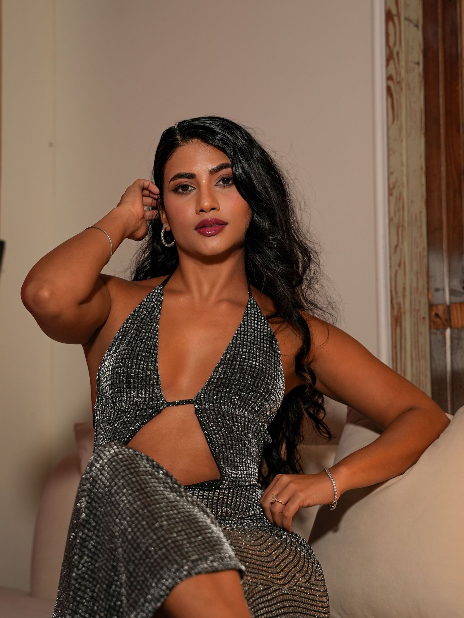 Fashion portraits showing sparkly evening wear against warm-toned background.