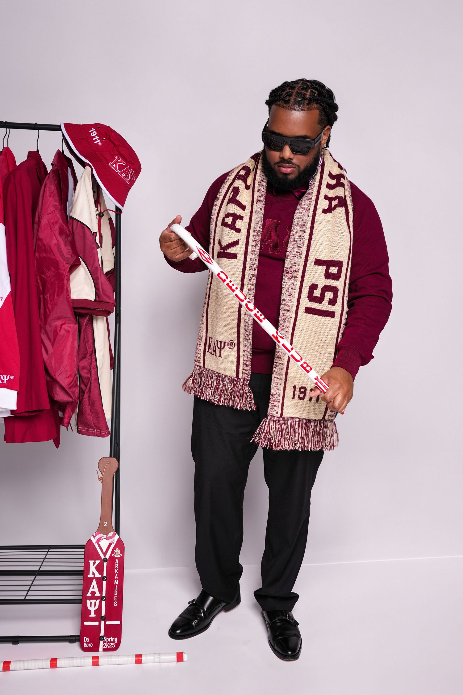 Fashion sequence featuring burgundy and cream collegiate apparel and accessories.