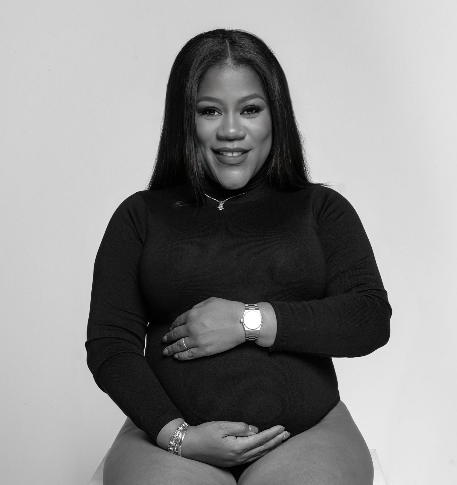 Black and white portrait series showing elegant poses in dark clothing.