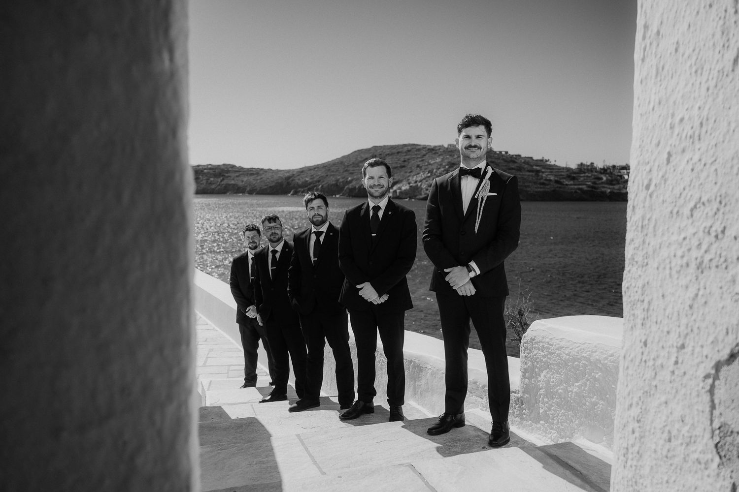 groomsmen at the ceremony documentary wedding photographer Ios Paros Tinos Mykonos Greece
