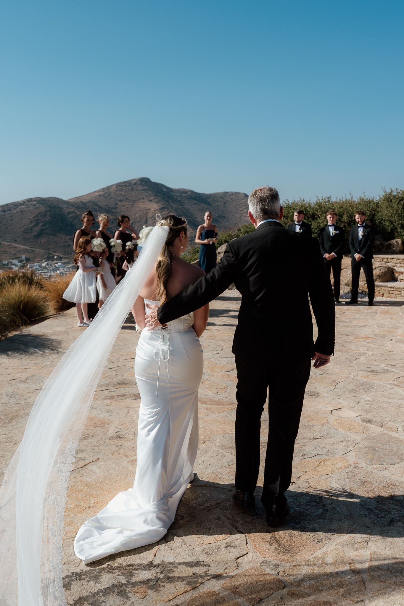 bride with father entrance documentary wedding photography in Ios Paros Tinos Sifnos Mykonos Greece