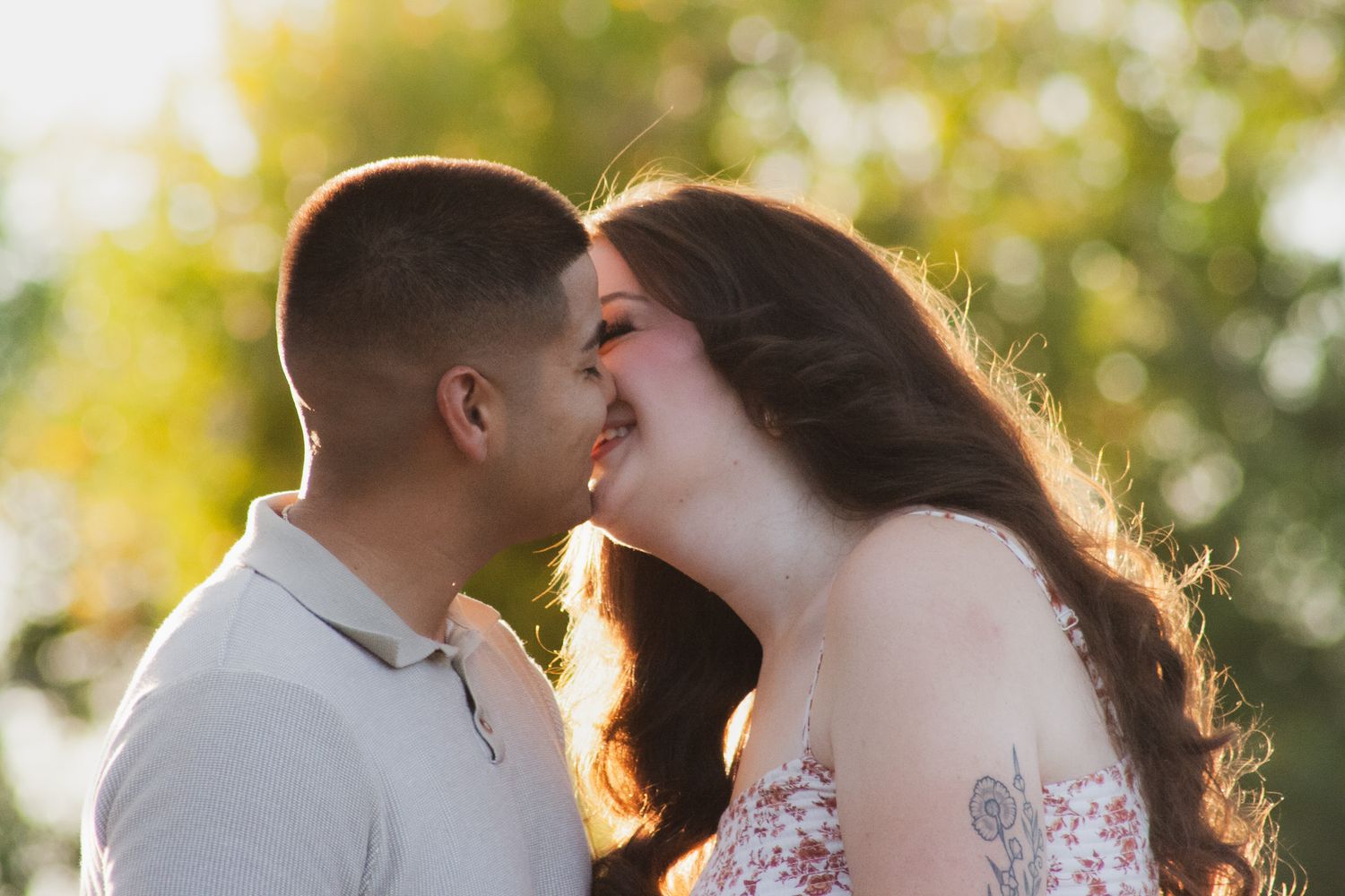 a couple kissing in beautiful golden hour