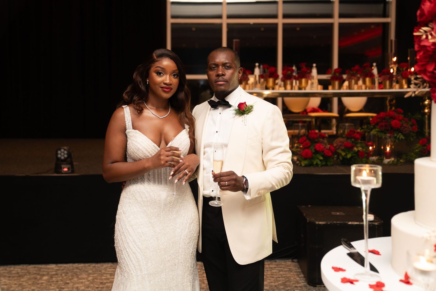 Wedding celebration scene with elegant decor and formal attire.