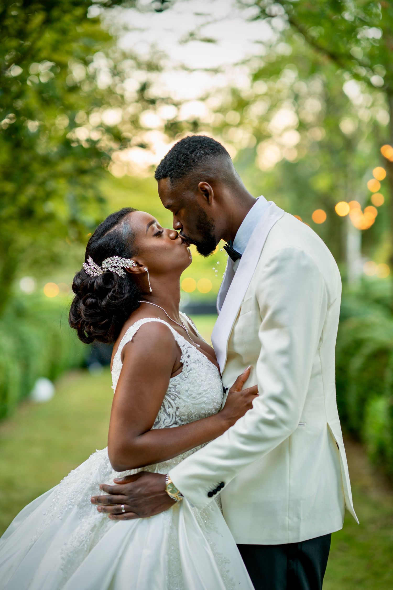 Intimate wedding photos showing tender moments between newlyweds in an outdoor garden setting.
