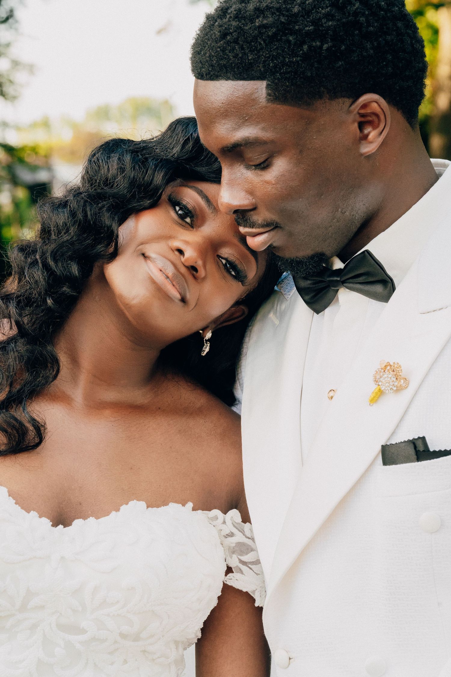 A series of intimate close-up wedding portraits showing tender moments between newlyweds.