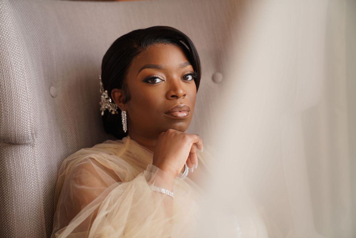 Soft, ethereal bridal portraits with delicate lighting and neutral backgrounds.