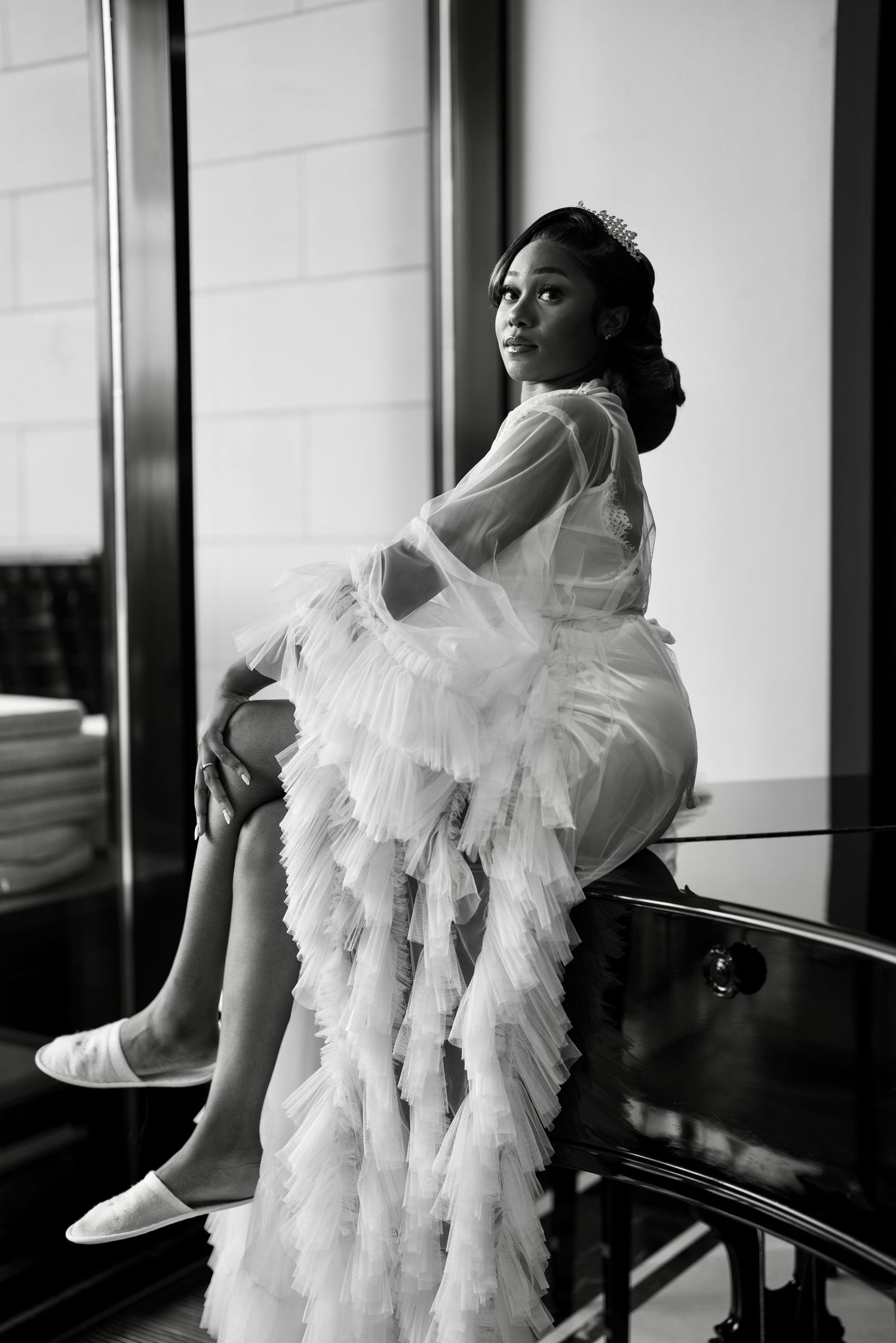 Artistic black and white shots of bridal fashion featuring dramatic ruffled dress details.