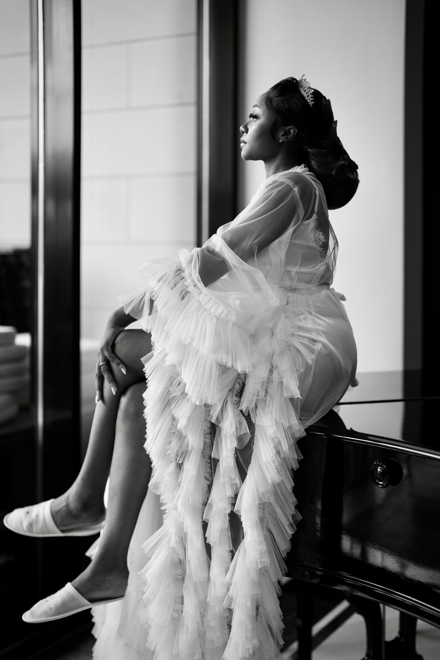 Minimalist black and white bridal portraits showcasing elegant dress movement and form.