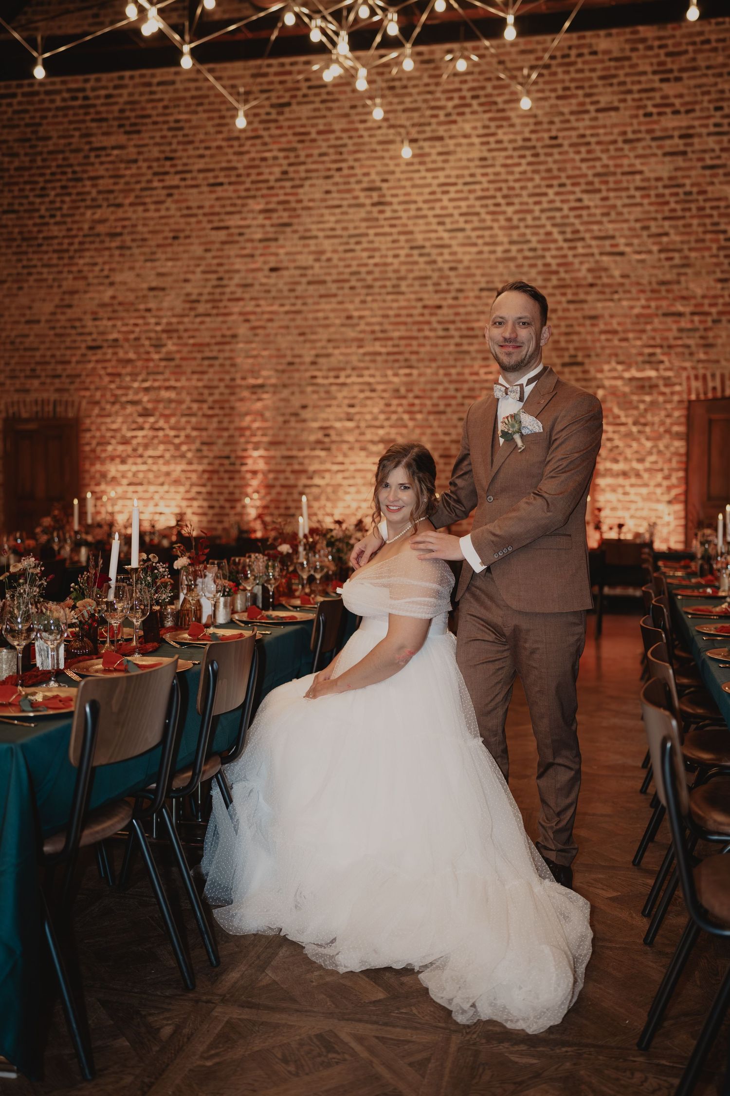 A series of wedding reception photos showing a couple dancing in an elegant brick-walled venue with teal decor.