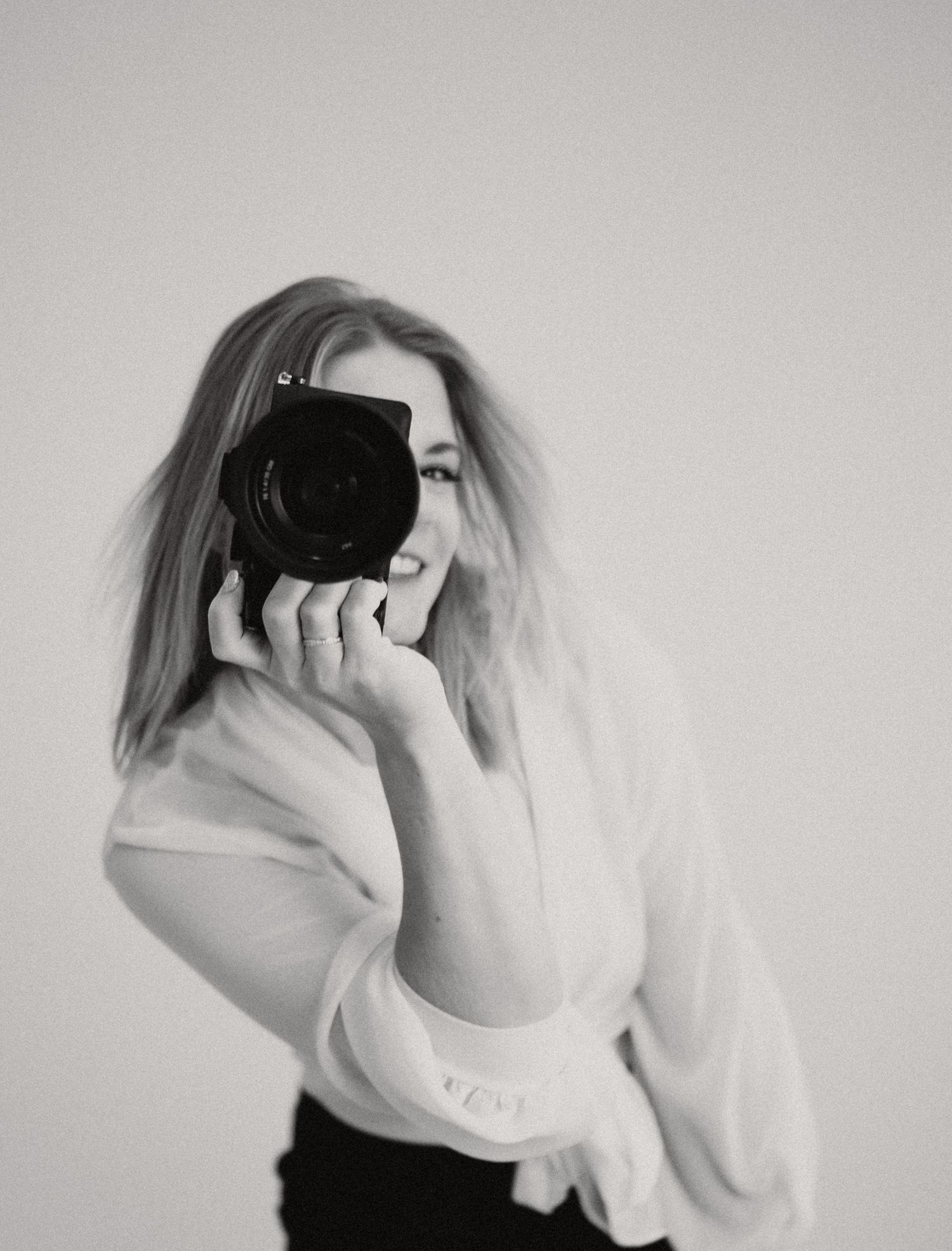 A series of black and white photographs showing someone using a virtual reality headset while wearing a white shirt.