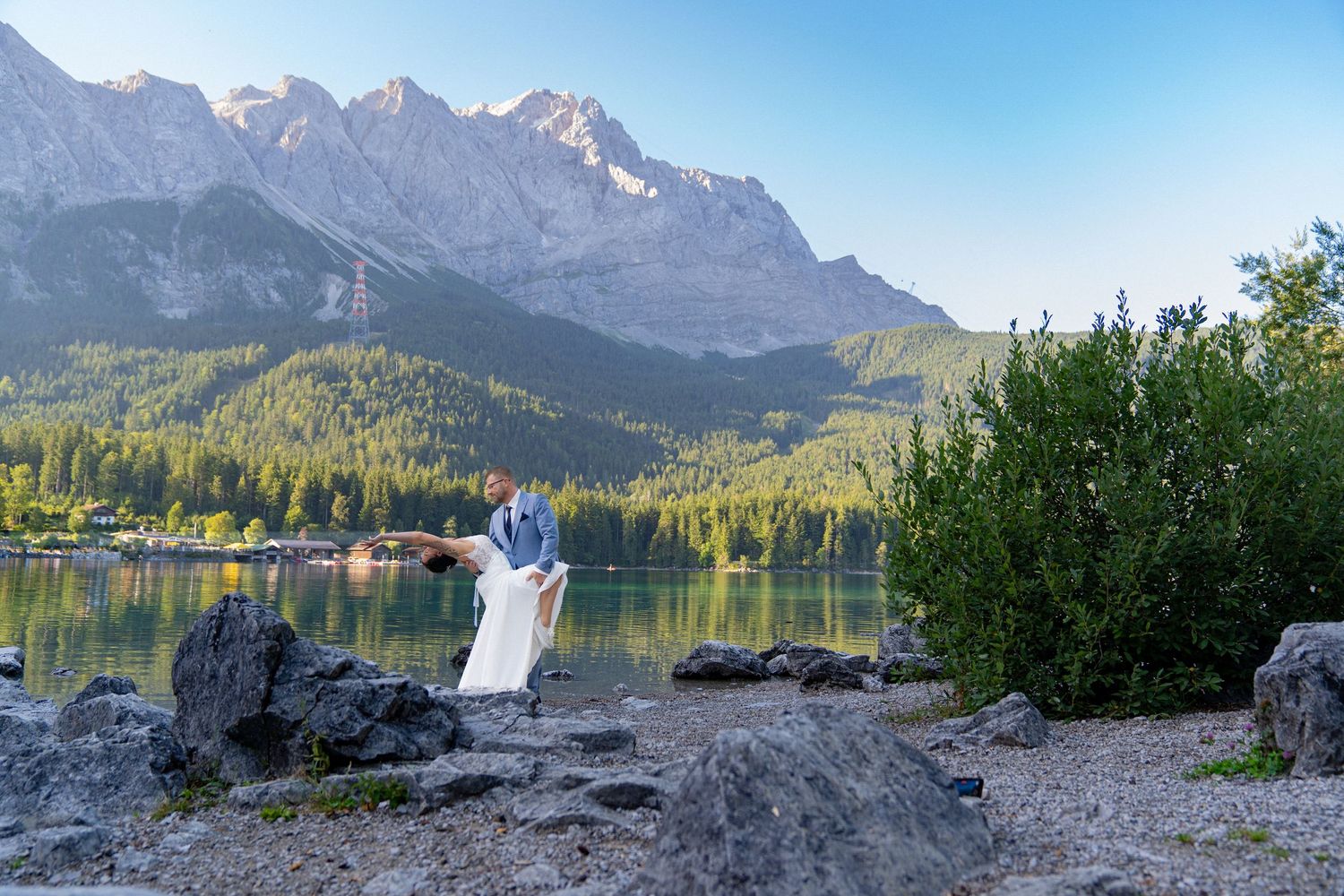 Panoramic mountain landscape with rocky peaks and alpine lake reflecting the rugged terrain in Banff National Park.