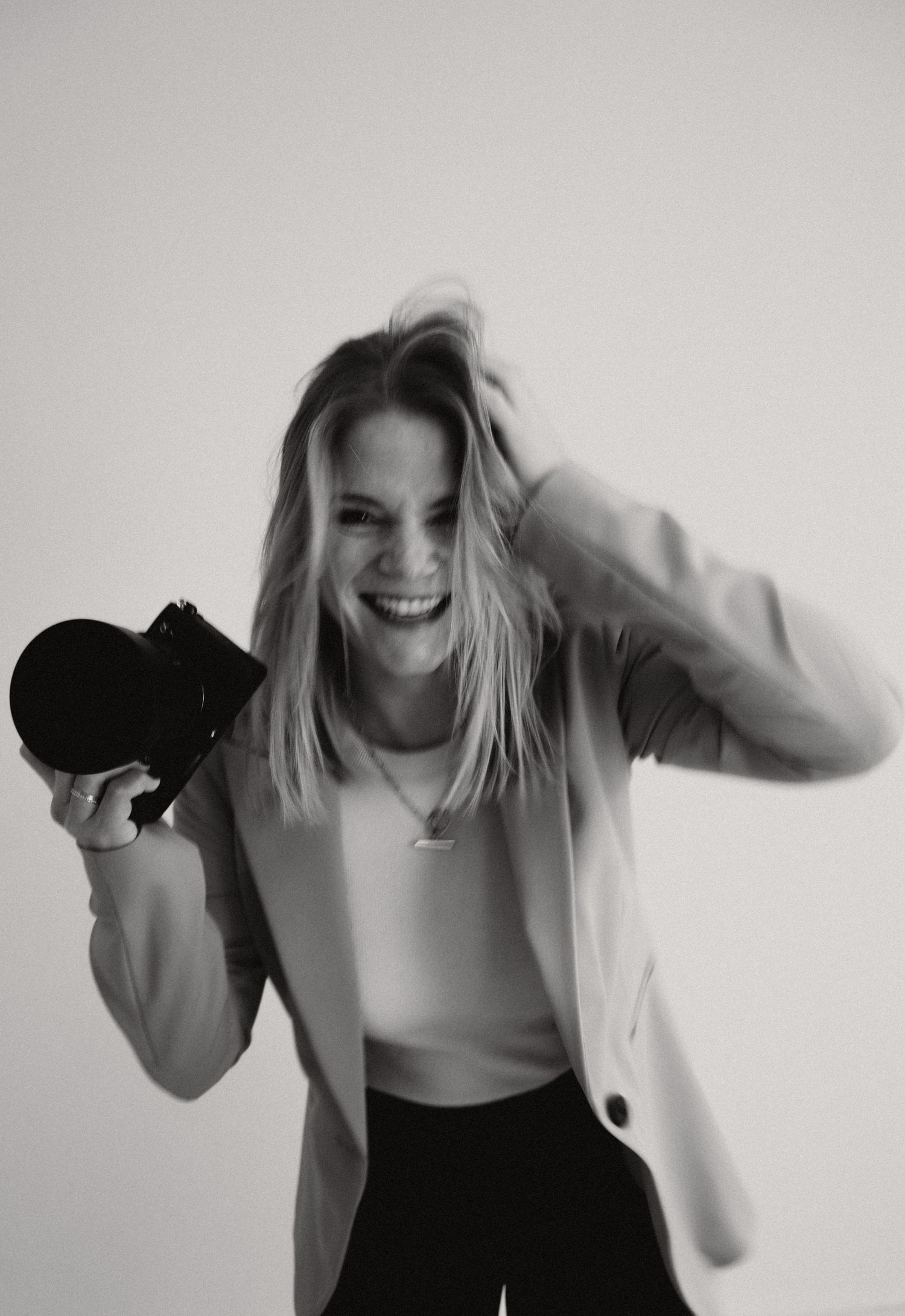 A sequence of black and white photos showing dynamic movement and dancing poses against a light background.