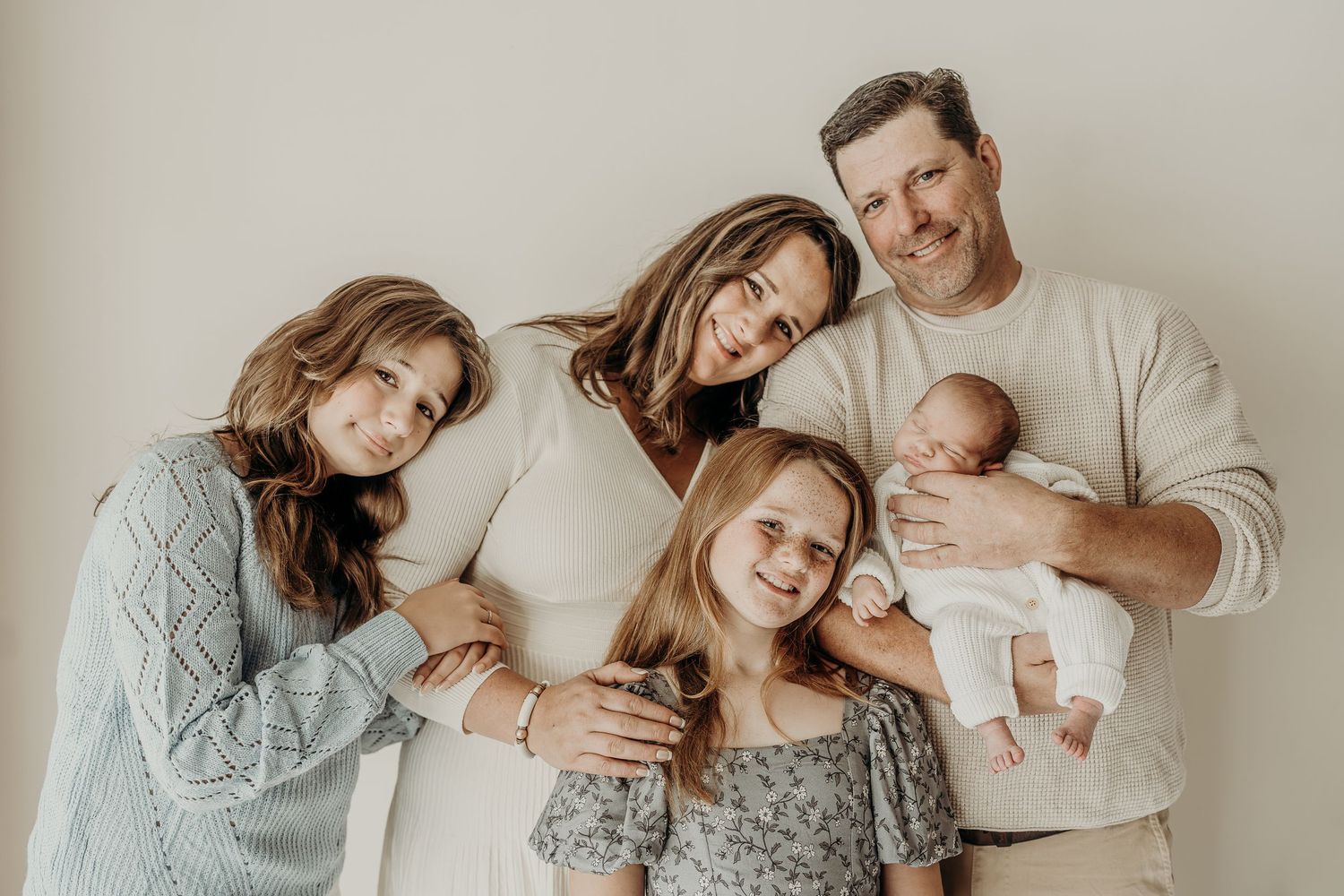 Family with newborn baby in a bright studio in East Troy, Wisconsin